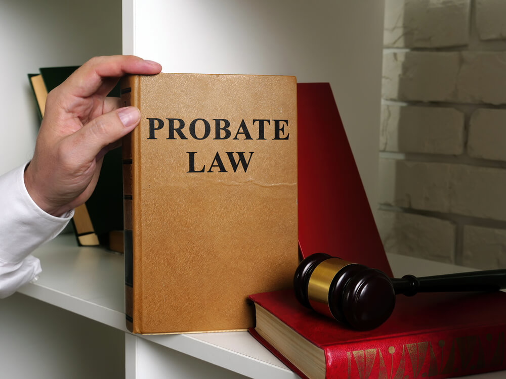 A probate attorney with a probate law book.